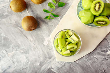 Composition with tasty ripe kiwi on tableの写真素材