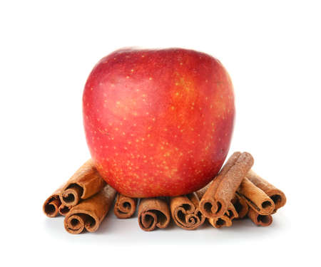 Fresh apple with cinnamon on white backgroundの写真素材