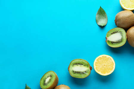 Tasty ripe kiwi and lemon on color backgroundの写真素材