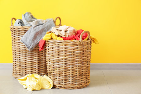 Baskets with dirty laundry on floorの写真素材