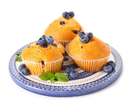 Plate with blueberry muffins on white backgroundの写真素材