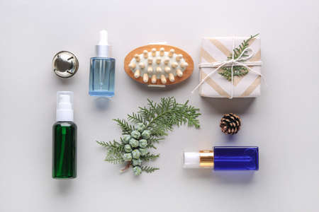 Christmas composition with gift and products for spa treatment on light backgroundの写真素材