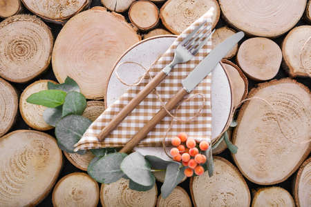 Table setting with floral decor on wooden backgroundの写真素材