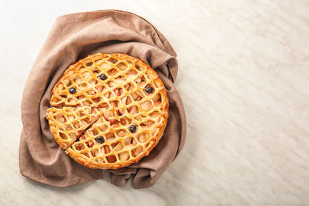 Tasty apple pie on light backgroundの写真素材
