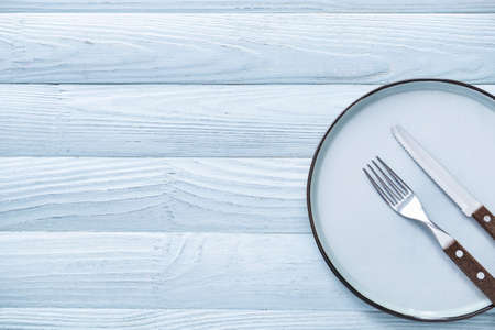 Simple table setting on gray wooden background