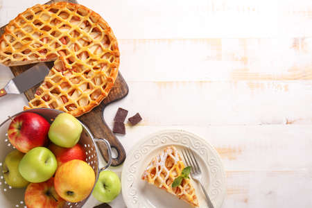 Composition with tasty apple pie on tableの写真素材