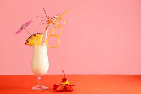 Glass of tasty Pina Colada cocktail on tableの写真素材