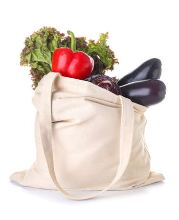 Stylish eco bag with fresh vegetables on white backgroundの写真素材