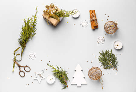 Frame made of Christmas decor on light background