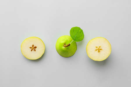 Fresh cut pear on gray background