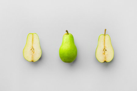 Tasty fresh pears on gray background
