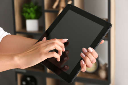 Young woman with tablet computer at home