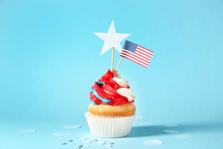 Tasty patriotic cupcake on color backgroundの写真素材