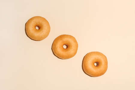 Sweet tasty donuts on color background