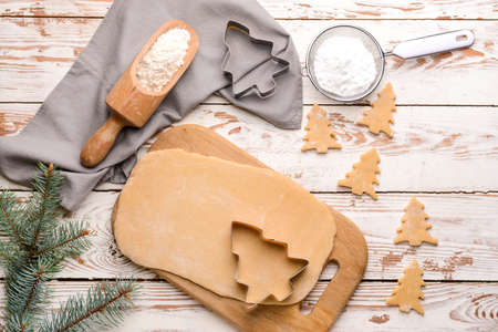 Preparing of tasty Christmas cookies on table