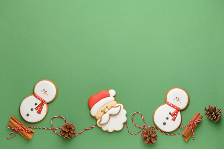 Tasty Christmas cookies on color background