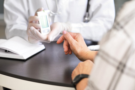 Doctor checking blood sugar level of diabetic patient in clinic