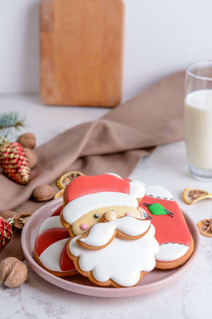 Plate with tasty Christmas cookies on table