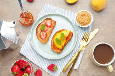 Plate with tasty sandwiches and cup of coffee on tableの写真素材