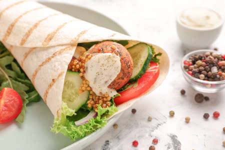 Plate with tasty falafel pita on table, closeupの写真素材
