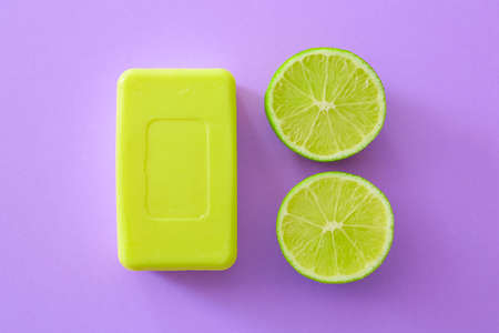 Soap bar and lime on color backgroundの写真素材