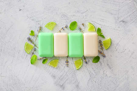 Different soap bars on light background