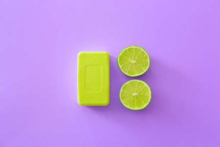 Soap bar and lime on color backgroundの写真素材