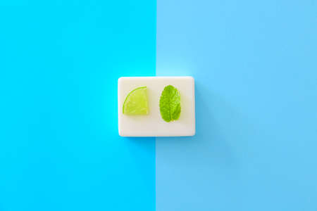 Soap with lime and mint on color backgroundの写真素材
