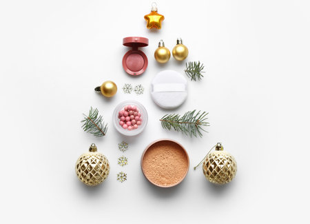 Christmas composition with decorative cosmetics on white backgroundの写真素材