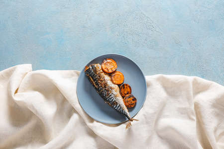 Plate with prepared mackerel fish on gray backgroundの写真素材