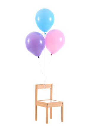 Air balloons with chair on white backgroundの写真素材