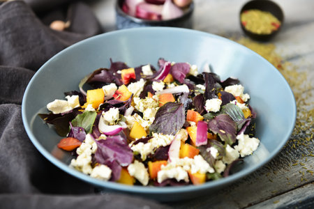 Bowl with tasty salad on table