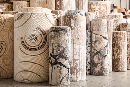 Many different carpets in shop
