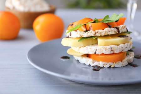 Plate with tasty fresh vegetables and crispbread on table, closeupの写真素材