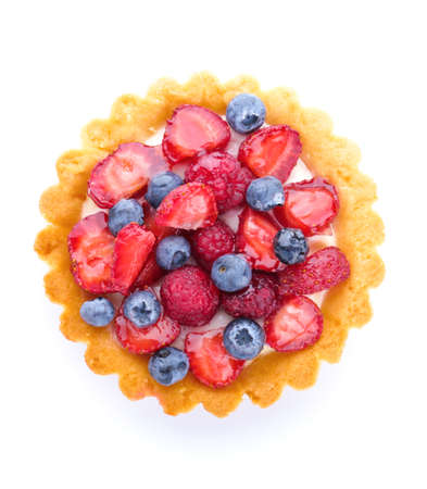 Sweet tartlet with berries on white background