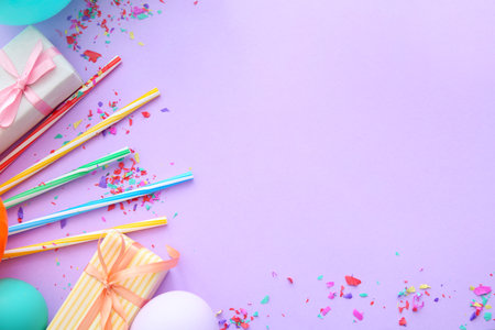 Composition with balloons, gifts and place for text on color backgroundの写真素材