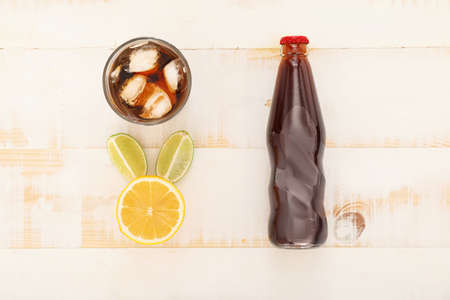 Composition with tasty cola on white wooden background