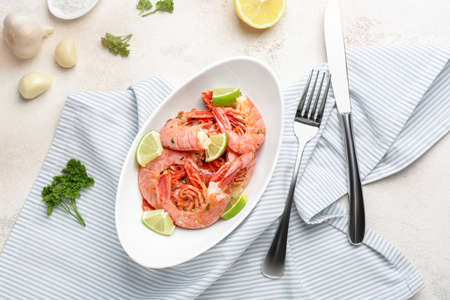 Plate with tasty shrimps on tableの写真素材