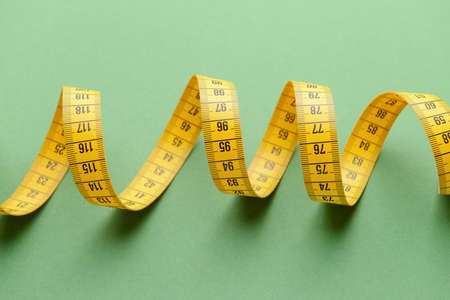 Measuring tape on color backgroundの写真素材