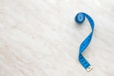 Measuring tape on light backgroundの写真素材