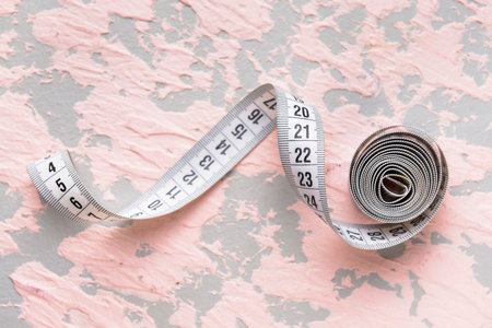 Measuring tape on color backgroundの写真素材