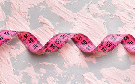 Measuring tape on color backgroundの写真素材