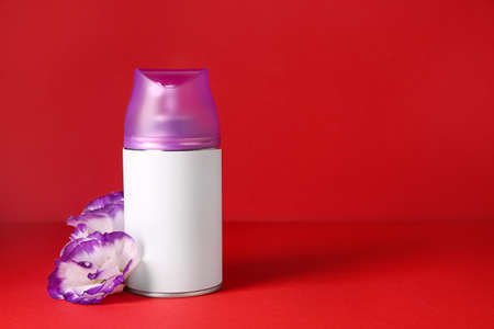Bottle of air freshener on color backgroundの写真素材