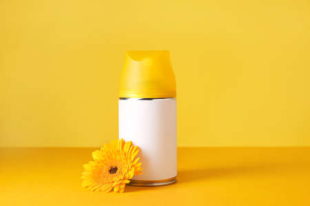Bottle of air freshener on color backgroundの写真素材