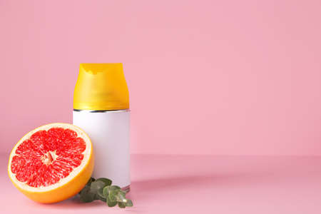 Bottle of air freshener on color backgroundの写真素材