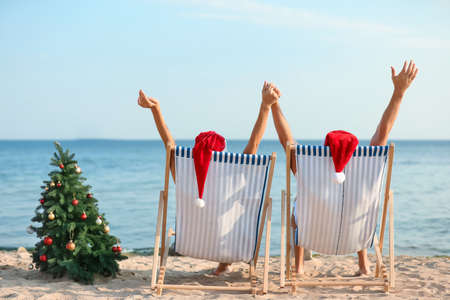 Happy couple celebrating Christmas at tropical resortの写真素材