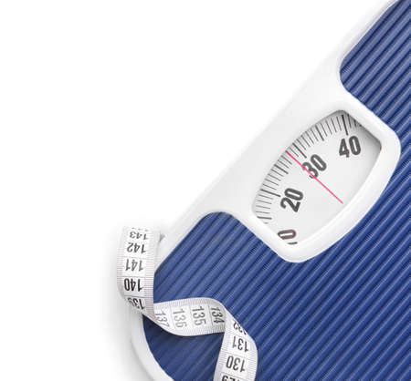 Scales and measuring tape on white background. Weight loss conceptの写真素材