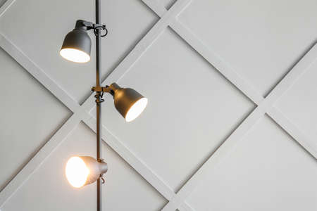 Glowing lamp on gray background