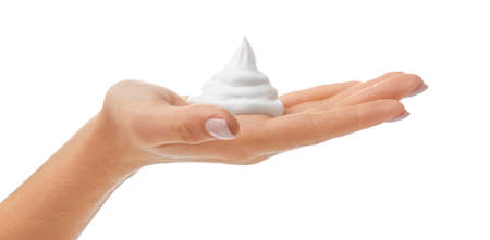 Female hand with soap foam on white backgroundの写真素材