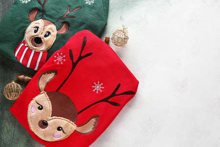 Christmas clothes on light background